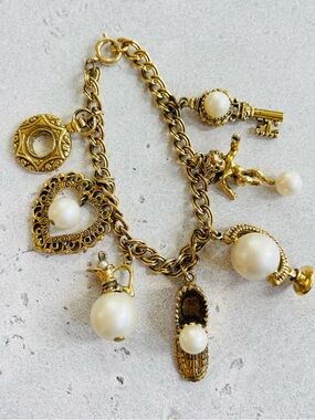 Vintage CIRCO Gold Tone Charm Bracelet Faux Pearl Cherub Key Globe Shoe Charms